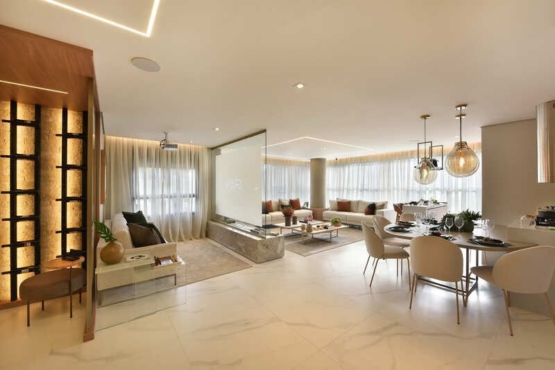Living integrado com sala de jantar no apartamento decorado